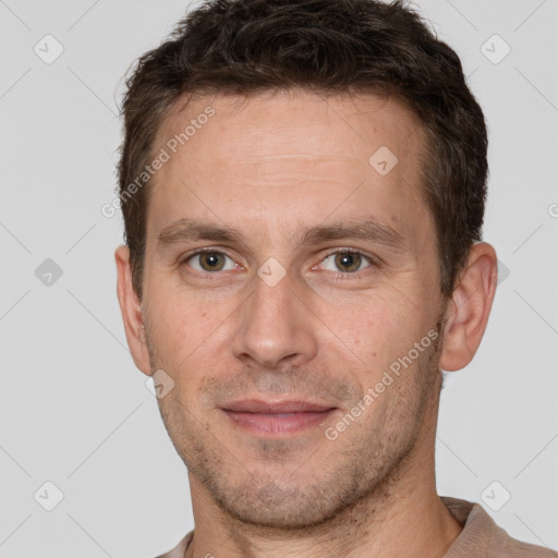 Joyful white adult male with short  brown hair and brown eyes