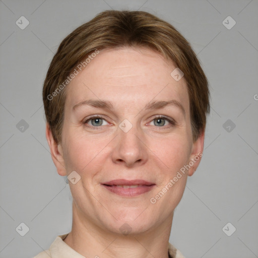 Joyful white adult female with short  brown hair and grey eyes