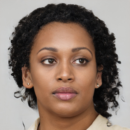 Neutral black young-adult female with long  brown hair and brown eyes