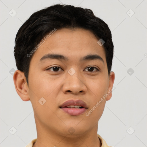Joyful latino young-adult male with short  brown hair and brown eyes