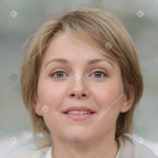 Joyful white adult female with medium  brown hair and blue eyes