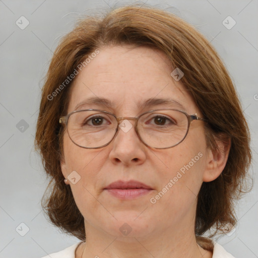 Joyful white adult female with medium  brown hair and brown eyes