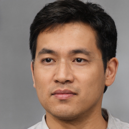 Neutral asian young-adult male with short  black hair and brown eyes