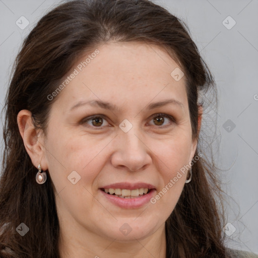 Joyful white adult female with long  brown hair and grey eyes