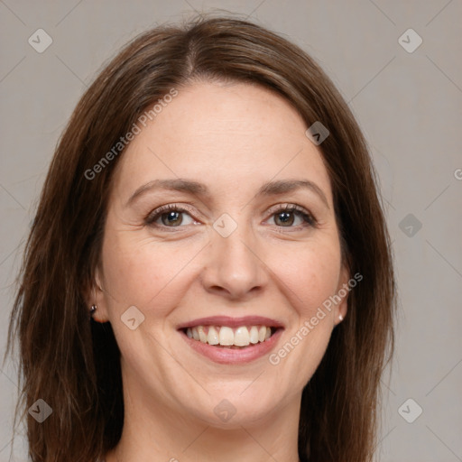 Joyful white young-adult female with long  brown hair and grey eyes