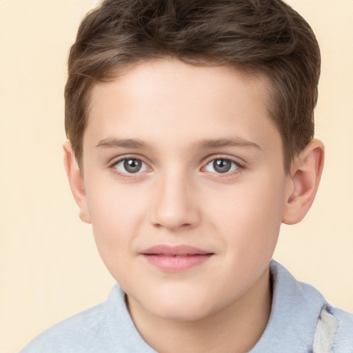 Joyful white child male with short  brown hair and brown eyes