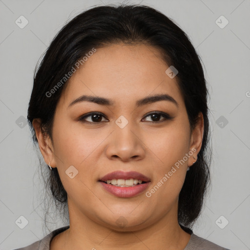 Joyful latino young-adult female with medium  brown hair and brown eyes