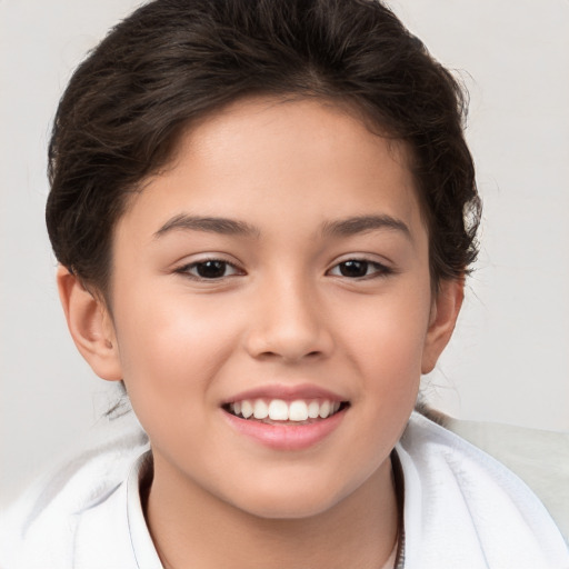 Joyful white child female with short  brown hair and brown eyes