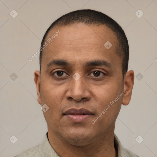 Neutral latino adult male with short  black hair and brown eyes