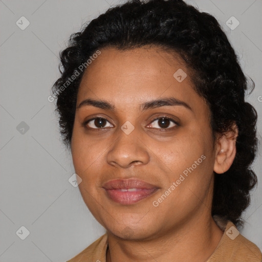 Joyful black young-adult female with medium  black hair and brown eyes