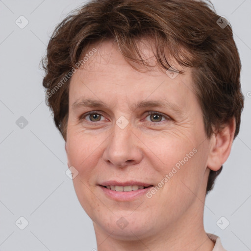 Joyful white adult female with short  brown hair and brown eyes