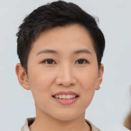 Joyful asian young-adult female with short  brown hair and brown eyes