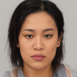 Neutral asian young-adult female with medium  brown hair and brown eyes