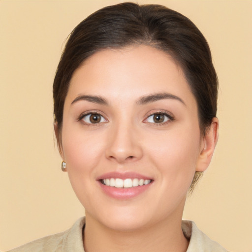 Joyful white young-adult female with medium  brown hair and brown eyes