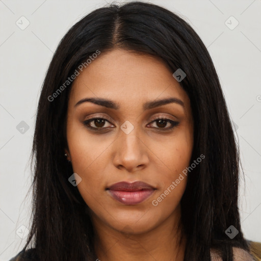 Joyful latino young-adult female with long  black hair and brown eyes