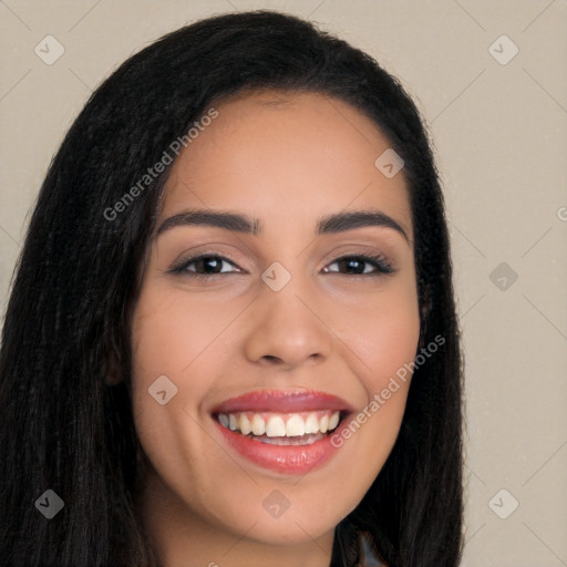 Joyful white young-adult female with long  black hair and brown eyes