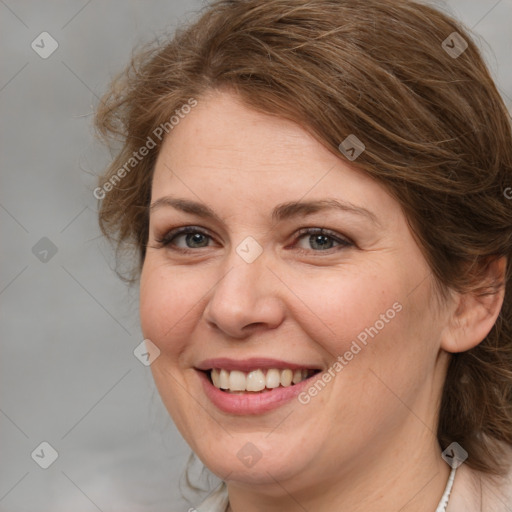 Joyful white adult female with medium  brown hair and grey eyes