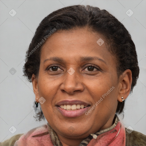 Joyful black adult female with medium  brown hair and brown eyes