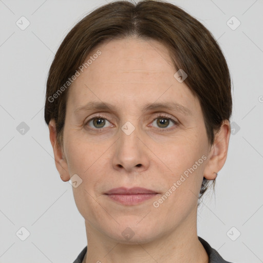 Joyful white adult female with short  brown hair and grey eyes