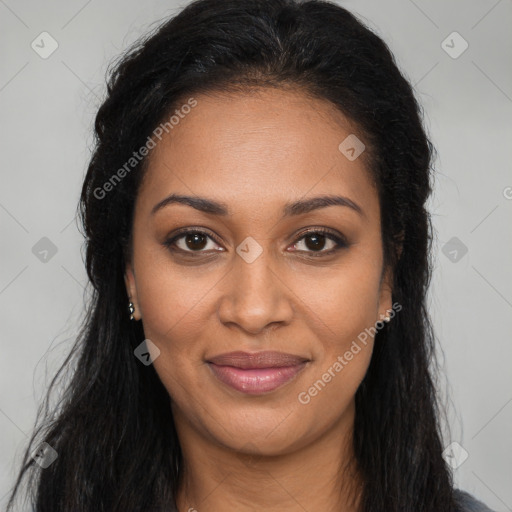 Joyful black young-adult female with long  brown hair and brown eyes