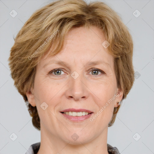 Joyful white adult female with medium  brown hair and grey eyes