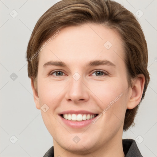 Joyful white young-adult female with short  brown hair and grey eyes