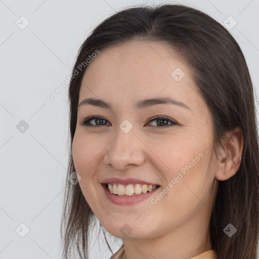 Joyful white young-adult female with long  brown hair and brown eyes