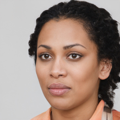 Neutral black young-adult female with medium  black hair and brown eyes