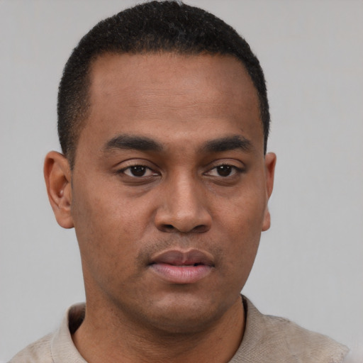 Neutral black young-adult male with short  black hair and brown eyes