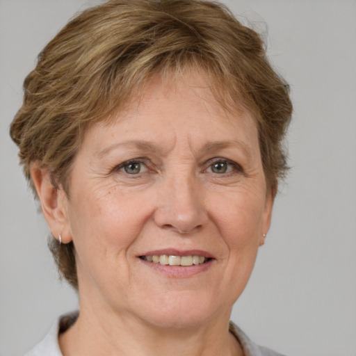 Joyful white middle-aged female with short  brown hair and brown eyes