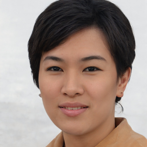 Joyful asian young-adult female with short  brown hair and brown eyes