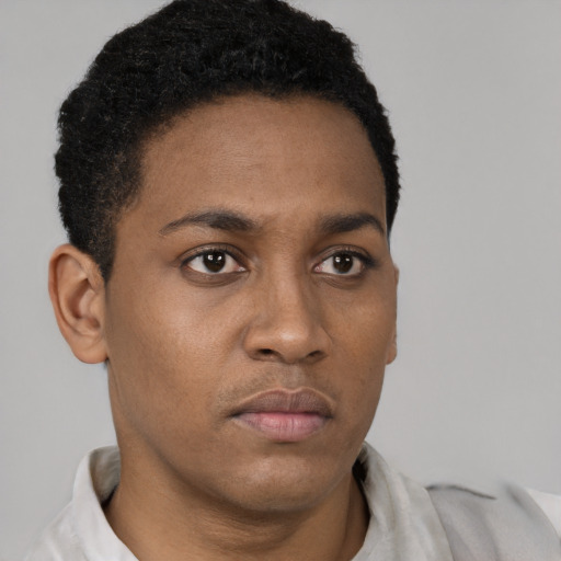 Neutral black young-adult male with short  black hair and brown eyes