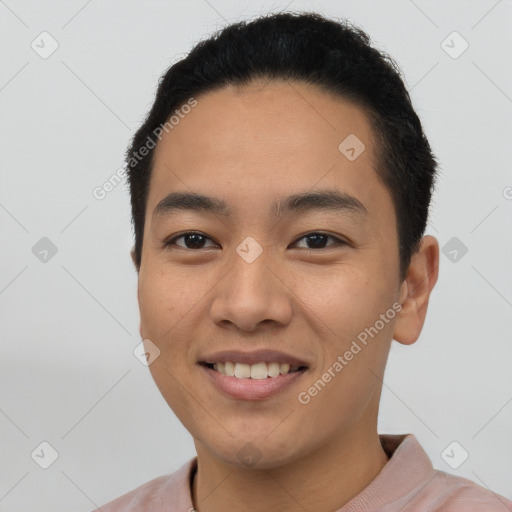 Joyful asian young-adult male with short  black hair and brown eyes