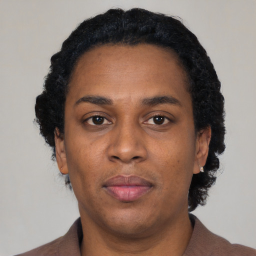 Neutral black adult female with short  black hair and brown eyes