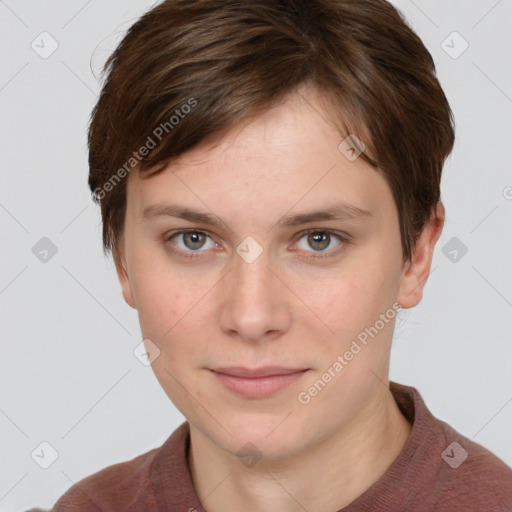 Joyful white young-adult female with short  brown hair and grey eyes