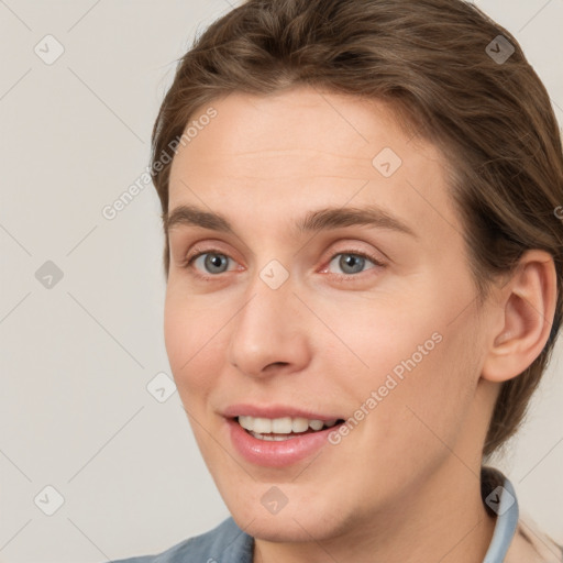 Joyful white young-adult female with short  brown hair and grey eyes