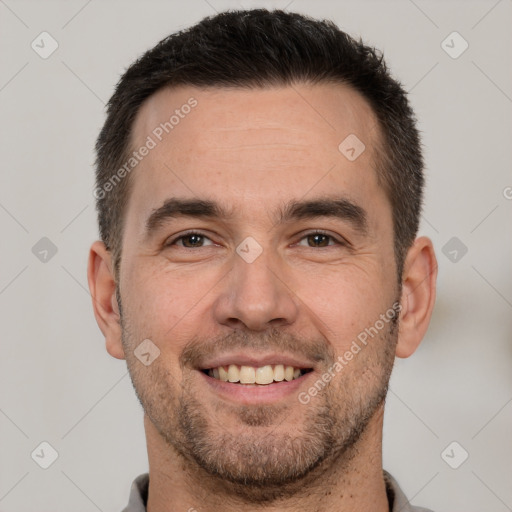 Joyful white adult male with short  brown hair and brown eyes