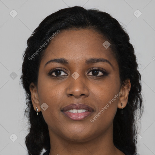 Joyful black young-adult female with long  black hair and brown eyes
