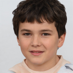 Joyful white child male with short  brown hair and brown eyes