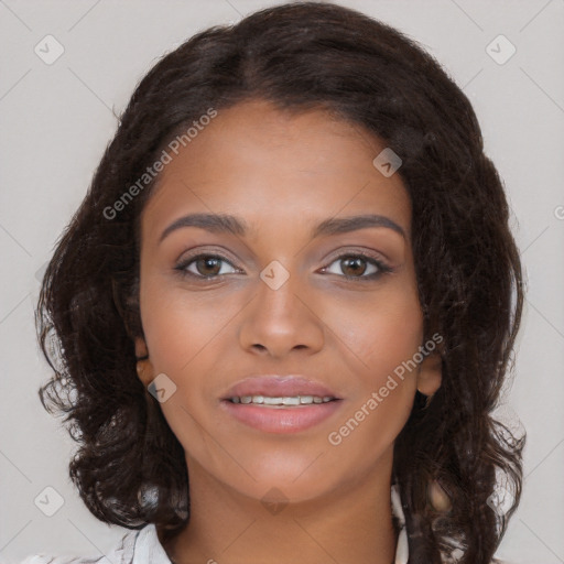 Joyful black young-adult female with long  brown hair and brown eyes