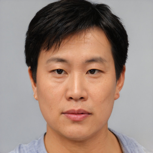 Neutral asian young-adult male with short  black hair and brown eyes