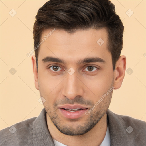 Joyful white young-adult male with short  brown hair and brown eyes