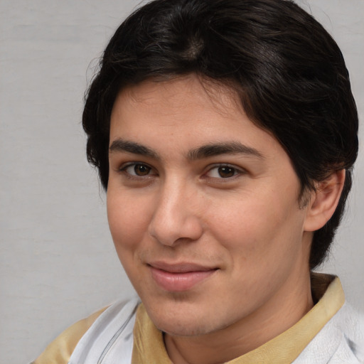 Joyful white young-adult male with medium  brown hair and brown eyes