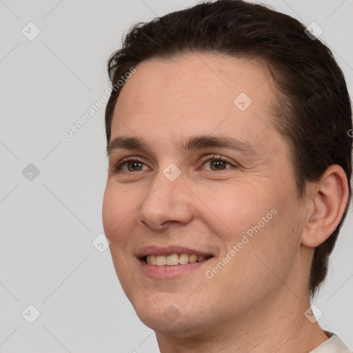 Joyful white young-adult male with short  brown hair and brown eyes