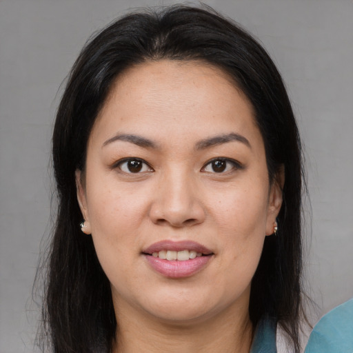 Joyful asian young-adult female with medium  brown hair and brown eyes