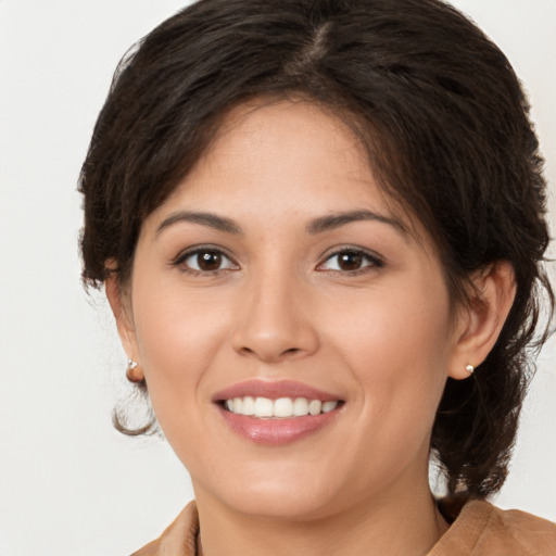 Joyful white young-adult female with medium  brown hair and brown eyes