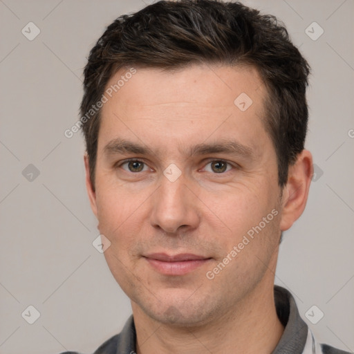 Joyful white adult male with short  brown hair and brown eyes