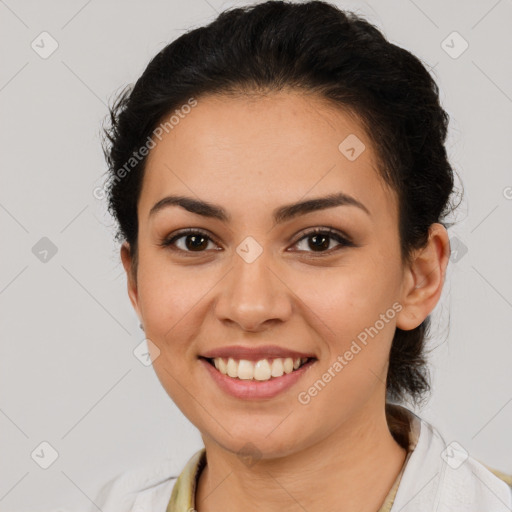 Joyful latino young-adult female with short  brown hair and brown eyes