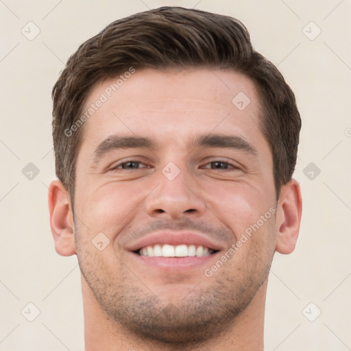 Joyful white young-adult male with short  brown hair and brown eyes