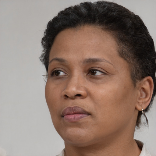 Neutral black adult female with short  brown hair and brown eyes